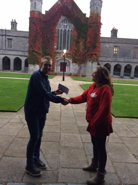 Thomas Chamberland receiving his prize from Cat